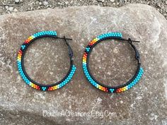 "Here's a pair of Turquoise with Native Colors hoop earrings that are lightweight and comfortable to wear all day long.  Made with high quality glass Delica Beads, beaded one bead at a time.  Made with high quality glass Delica Beads, beaded one bead at a time. Love and passion goes into making my jewelry. This process requires focus, patience and dedication. Each bead is 16th of an inch and can take hours to complete a project. They are 2\" wide around. They would be a great addition to your wa Black Hoop Earrings, Native American Beadwork Patterns, Native Earrings, Native Beading, Black Hoops Earrings, Beaded Jewlery, Native American Beadwork, Beaded Earrings Patterns, Beadwork Patterns