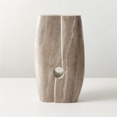 a marble vase sitting on top of a white table