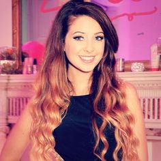 a beautiful young lady with long, wavy hair