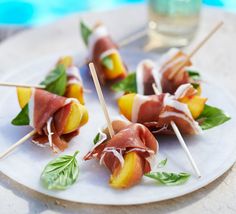 small appetizers are arranged on a plate by the pool, ready to be eaten