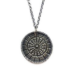 This unique and textural carved medallion is reversible to another carved pattern. It is reminiscent of a mandala. The meaning of mandala is Sanskrit for "circle." A mandala has a concentric structure, offering balancing visual elements. The purpose of a mandala is to serve as a tool to help harmonize and bring about unity, to absorb the mind so that the chatter stills and higher consciousness can be reached. Made of sterling silver on an oxidized, adjustable 16-18" sterling chain. Silver Medallion Necklace For Meditation, Etched Medallion Amulet Necklace, Spiritual Medallion Necklace With Etched Details, Engraved Medallion Necklace, Traditional Round Medallion Necklace Engraved, Artisan Carved Medallion Necklace, Traditional Round Engraved Medallion Necklace, Artisan Etched Medallion Necklaces, Traditional Engraved Round Medallion Necklace