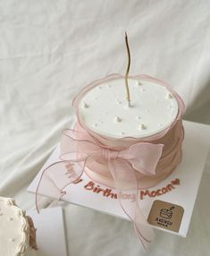 a cake with a pink bow on top