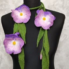 Felted wool necklace pansies made from soft merino wool and  fibers viscose and silk. The wool necklace is a 50-inch long stem. There are 2 flowers on one side and 1 flower on the other side of felt lariat. These flowers in purple with pink and white . The diameter of the flowers is 3.5 - 4  inches. This woolen jewelry can be worn on any clothing. Also, such a felt flower necklace can be an original gift for a woman More felt necklaces and scarves here: https://www.etsy.com/shop/EmbroideredFeltG Felt Flower Necklace, Wool Necklace, 2 Flowers, Felt Necklace, Flowers Jewelry, Necklace For Mom, Scarf For Women, Felt Flower, Felted Wool