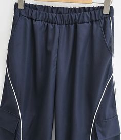 Women Relaxed Front Pocket Cargo Trousers With Striped Detail – Sun-Imperial Casual Navy Bottoms With Patch Pockets, Sporty Navy Pants With Pockets, Navy Pants With Pockets For Summer, Navy Summer Pants With Pockets, Navy Wide Leg Cargo Pants With Pockets, Navy Bottoms With Side Pockets For Spring, Navy Casual Cargo Pants With Pockets, Casual Navy Cargo Pants With Pockets, Navy Casual Cargo Pants