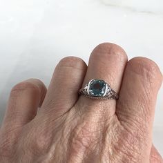 Details: Beautiful Edwardian Aquamarine 18K white gold filigree ring. This ring is very sweet, with delicately detailed filigree with tiny French fleur-de-lis . The aquamarine measures 7.3mm round. The ring is stamped 18K on the inside of the band. Measurements: Ring measures a size 6 1/2 US. It can be re-sized for a fee. Condition: The overall all condition of this ring is very good. Please ask all questions prior to placing an order. Fine Jewelry Sapphire Ring With Filigree, Classic Engraved White Gold Ring With Gemstone, Elegant Yellow Gold Topaz Ring In Sterling Silver, Elegant Platinum Topaz Gemstone Ring, Elegant Rose Cut Diamond Birthstone Ring For Formal Occasions, Elegant Platinum Topaz Ring, Elegant White Gold Birthstone Ring With Gemstone, Elegant White Gold Filigree Ring In Sterling Silver, Elegant Silver-colored 14k Gold Birthstone Ring