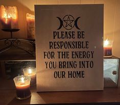 a sign that says please be responsible for the energy you bring into our home next to some candles