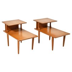 two wooden tables sitting next to each other