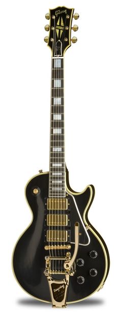 a black and gold guitar is shown against a white background