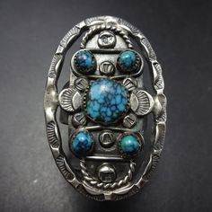 VINTAGE TURQUOISE RING DESCRIPTION:  This exquisite ring features rare stampwork circa 1940s and breathtaking specimens of high blue turquoise with tight black spiderweb matrix. This museum quality ring will be a cherished addition to your collection of quality vintage Southwestern and Native American jewelry. MEASUREMENTS:  Ring face measures 1 1/2" x 1" RING SIZE:  6 1/4 WEIGHT: 11.9 grams SIGNED:  no STERLING:  unmarked, verified sterling silver Antique Handmade Turquoise Blue Ring, Vintage Silver Turquoise Ring For Collectors, Antique Handmade Turquoise Collectible Ring, Native American Words, Adjustable Vintage Nickel-free Turquoise Ring, Vintage Turquoise Ring, One-of-a-kind Silver Turquoise Ring In Sterling Silver, Cowgirl Jewelry, Turquoise Jewelry Native American