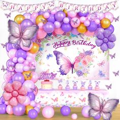 a birthday card with balloons, butterflies and cake on the table in front of it