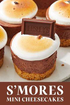 there are mini cheesecakes with marshmallow toppings on top and the title says, s'mores mini cheesecakes