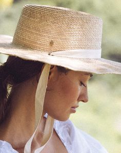 Handmade by artisans in Mexico, our new palm hats are a must-have for the warmer months. Featuring a tightly woven pressed palm design with an intricate scalloped brim, The Cortez Palm Hat is intentionally designed for a day under the sun. Essential yet elevated, this hat comes with both an ivory and black ribbon to accommodate your entire wardrobe. 100% Palm Leaf Ethically Handmade in Mexico Interchangeable ivory and black ribbon Inner elastic band to help with fit Spot / specialist clean SIZE Sunhat With Ribbon, Mama Bracelet, Raffia Hat, Sustainable Manufacturing, Sun Hats For Women, Feminine Power, Snake Necklace, Cruise Outfits, Beach Hat