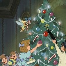 an animated christmas tree with several children around it and one child reaching up to put candy on the top