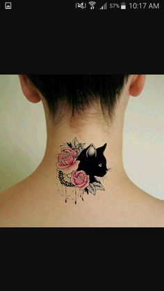 a woman's back neck with a cat and roses tattoo on her left side