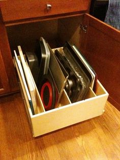 an open drawer with many different items in it