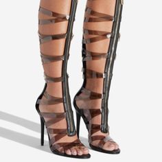 A Sexy Gladiator Sandal Featuring A High Stiletto Heel, Transparent Straps, And Front Zipper Closure. Material: Faux-Leather Color: Clear Outside Heel Height: 4.5" Closure: Functional Front Zipper Black Heels With Transparent Straps, Black Heels With Transparent Straps For Summer, Night Out Heels With Transparent Straps And Open Toe, Night Out Open Toe Heels With Transparent Straps, Trendy Strapped Heels For Party, Strapped Sandals With Wrapped Heel For Party, Strapped Heels For Summer Night Out, Strapped Black Heels For Party, Black Strapped Heels For Party