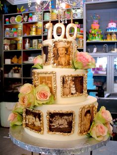 a three tiered cake decorated with pictures and flowers