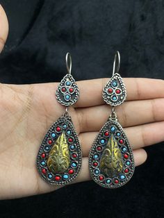 A Very Beautiful Handmade Turkmen Silver Gold Plated Earrings From Afghanistan. Shipping Payment Feedback & Return Policy 1 : We ship Monday to Friday Via Airmail Register Insured  With Tracking # takes 2 to 4 Weeks to Destination. 2 : Contact us if you did not receive your item after 4 weeks. 3 : We Accept Payment Only Via PayPal. 4 : In Any Inconvenience Case we do Accept Return and full Refund. 5 : We Ship worldwide via Airmail Registered with Tracking # provided to buyer after shipping . 6 : Traditional Turquoise Danglers For Gift, Blue Metal Earrings With Latkans, Blue Festival Earrings With Latkans, Handmade Blue Drop Earrings, Traditional Turquoise Earrings With Latkans, Bohemian Blue Danglers, Traditional Silver Teardrop Beaded Earrings, Blue Metal Earrings For Festivals, Vintage Multicolor Latkan Earrings