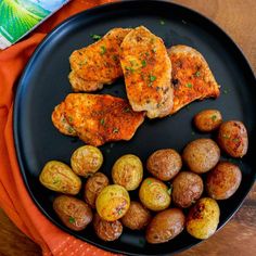 a plate with some meat and potatoes on it