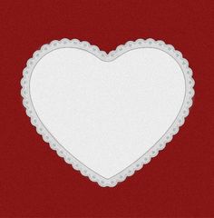 a white heart shaped frame on a red background