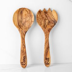 two wooden spoons with the words good and bad written on them