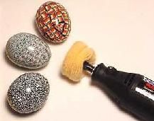 an electric polisher is used to paint decorative easter eggs with glitter and beading