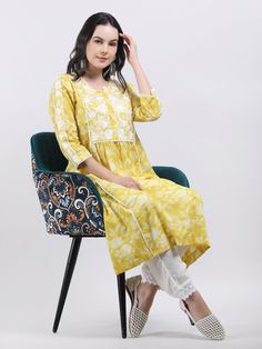 Latest Style Indian Designer Embroidered Cotton A- line Kurta Elevate your ethnic wardrobe with this exquisite Women's Yellow Floral Printed Cotton A-Line Chikankari Embroidered Kurta. This stunning kurta seamlessly blends traditional charm with contemporary style, making it a versatile addition to your collection. Adorned with a beautiful floral print, this kurta features intricate Chikankari embroidery that showcases timeless craftsmanship. The delicate patterns and vibrant hues add a touch of Spring Anarkali Kurta With Bandhani Print, Anarkali Kurta With Multicolor Embroidery For Summer, Spring Cotton Traditional Wear With Embroidered Border, Yellow Bandhani Print Traditional Wear, Summer Anarkali Traditional Wear With Embroidered Border, Summer Anarkali With Embroidered Border, Traditional Bandhani Print Sets For Spring, Yellow Cotton Kurta With Embroidered Border, Mulmul Kurta For Diwali