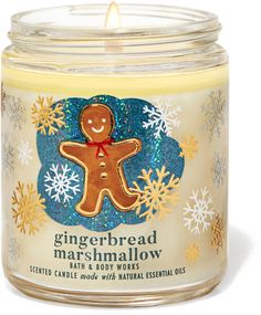 a gingerbread marshmallow candle in a glass jar