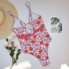 Sparkling rose all day in pretty Rosa One Piece Swimsuit. Feminine one piece swimwear features colorful flower print stretch fabric. This classic cut floral bathing suit offers the perfect amount of bottom coverage. Swim or lounge because you can enjoy it in and out of the water. Congratulations, you are one of the first to try our new swim collection! Details: Classic cut Rosa One Piece Swimsuit Bust is padded and wire free This style runs small, we recommend sizing up one full size from your t Floral Print Stretch Tankini For Sunbathing, Stretch Floral Print Tankini For Sunbathing, Summer Floral Print Sleeveless Bodysuit, Summer Sleeveless Floral Bodysuit, Sleeveless Summer Bodysuit With Floral Print, Beachy Swimwear With Floral Print And Stretch, Beachy Stretch Swimwear With Floral Print, Printed One-piece Bodysuit For Sunbathing, Summer Floral Print Stretch Bodysuit