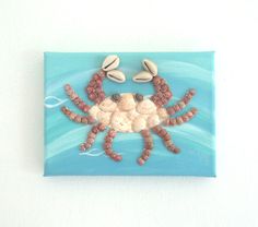 a ceramic crab with shells on its back