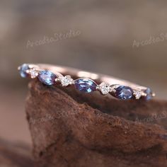 an image of a wedding ring with blue stones