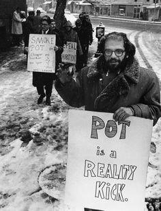 a black and white photo of people holding protest signs in the snow with words on them that read pot is a reality kick