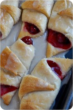 several pastries are arranged on a baking sheet