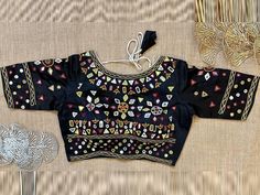 Buy black multicolor thread and mirror work blouse online in USA. Elevate your saree style with exquisite readymade saree blouses, embroidered saree blouses, Banarasi sari blouse, designer saree blouse, choli-cut blouses, corset blouses from Pure Elegance Indian fashion store in USA.-front Designer Black Tops For Festive Season, Designer Black Tops For Festive Occasions, Designer Multicolor Blouse Piece For Navratri, Fitted Multicolor Blouse Piece With Mirror Work, Fitted Multicolor Tops With Dori Work, Designer Embroidered Black Blouse Piece, Multicolor Saree Blouse With Dori Work, Multicolor Embroidered Blouse For Party Festivals, Black Embroidered Designer Blouse Piece