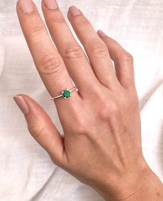 Handmade ring in top quality silver, type of solitaire ring with 5.5mm emerald zircon stone. There are three sizes available in Spain sizes: 11-15-18 in US 5 3/4 - 7 1/2 - 8 1/2 Elegant ring, engagement ring, minimalist ring, everyday silver ring with emerald birthstone ♦DETAILS * AAA certified high quality emerald zirconia size 5.5mm *  Ring size:  11-15-18 in Spain. US size: 5 3/4 - 7 1/2 - 8 1/2 * High quality handmade silver jewelry.  * Technique used: Handmade ring in top quality sterling s Round Stone Ring, Silver Emerald Ring, Emerald Birthstone, Emerald Green Color, White Jewelry Box, Tarnished Silver, Ring Emerald, Silver Jewelry Handmade, Silver Band Ring