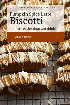 pumpkin spice latte biscotti with white icing on a wire cooling rack