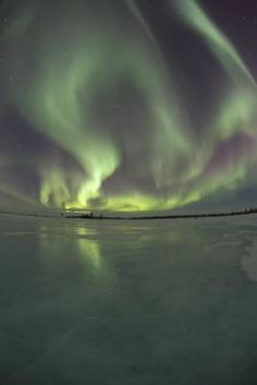 the aurora lights shine brightly in the night sky