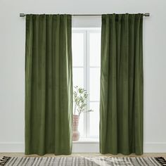 Block all unwanted light and add luxe style to your windows with the Better Homes & Gardens Green Velvet Rod Pocket 100% Blackout Curtain. Available in several solid colors and length options, each curtain panel features luxuriously soft velvet fabric with a subtle sheen to elevate the look. A must-have for bright rooms, each blackout curtain blocks outside light, reduces outside noise, and improves energy efficiency by keeping rooms cooler in the summer and warmer in winter. The curtain's rod p Green Velvet Curtains, Keeping Rooms, Curtain Green, Room Cooler, Green Velvet Fabric, Kitchen Curtain Sets, Window Treatments Living Room, Velvet Drapes, Window Treatments Bedroom