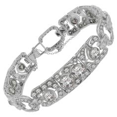 A true treasure from the Art Deco era, circa 1930, this bracelet features approximately 16 carats of diamonds set in lovely patterns around open platinum work. Five of the largest diamonds on the bracelet weigh over 1 carat each! The diamond settings are finished with hand applied millgrain in traditional deco fashion. Hand-fabricated in platinum, a fine Art Deco diamond bracelet worth of any collection. Length: 7 inches Platinum Bracelet, Retro Bracelet, Art Deco Bracelet, Style Deco, Diamond Settings, European Cut Diamonds, Art Deco Diamond, Art Deco Era, Antique Diamond