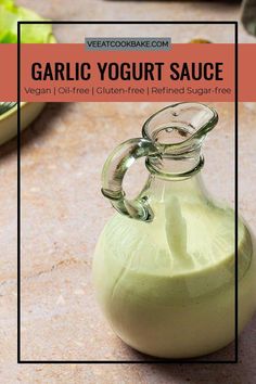 a small glass bottle filled with yogurt sauce on top of a countertop