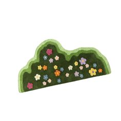 a green rug with colorful flowers on it and a hill in the middle that is made out of grass