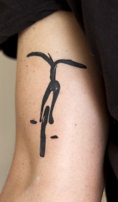 a person with a bike tattoo on their arm and leg is shown from the waist up