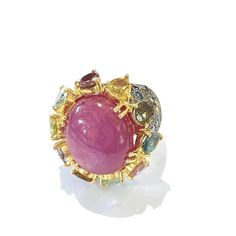 This is part of Chairish’s Fine Jewelry assortment.  Center Oval Shape Natural Ruby - 4 Carat  Multi color Natural Sapphires from Sri Lanka 2.50 Carat  Round and Pear shape Brilliant Colors: Pink, Yellow, Rose, Green and Blue   This Ring is from the "Orient" traveling collection are the epitome of elegance and versatility. It offers a perfect blend of day to night and swimwear to evening wear, allowing you to effortlessly transition between different occasions and outfits.  Wearing these spectac Rose Green, Multi Sapphire, Natural Sapphire, Natural Ruby, Evening Attire, Yellow Rose, Brilliant Colors, Pear Shape, Pear Shaped