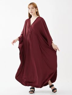 "🚚..ALL ORDERS ARE SHIPPED VIA DHL EXPRESS MAIL This soft red caftan dress is a great timeless wardrobe essential that you should not miss. Great for all shapes and sizes. * Pullover style * Deep v neck * Ruched detail at front with weaving rope strips * Batwing sleeves * Relaxed fit * For a slouchy silhouette * Unlined Measurements approximately: Sleeve Length (from side of neckline): 25\" (63.5 cm) Sleeve cuff: 18\" (46 cm)-round Bust: 66\" (168 cm)-all around. Hips: 60\" (152 cm)-all around. Red V-neck Kaftan For Party, Red Free Size V-neck Kaftan, Flowy Red V-neck Kaftan, Elegant Red V-neck Kaftan, Red Silk Maxi-length Kaftan, V Neck Kaftan, Plus Size Kaftan, Timeless Wardrobe, Soft Red