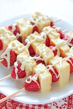 strawberry shortbreads with white icing on a plate