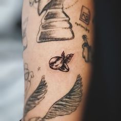 a person with a tattoo on their arm has a bell and pepper shaker in the background