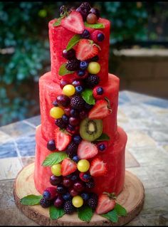 a watermelon cake with fruit on top