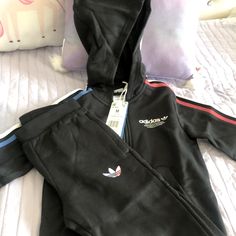 Black Adidas Jogging Suit - Nwt Medium Kids Size 5-6 Adicolor Full-Zip Hoodie Set Black Winter Sports Sets, Black Hooded Cotton Set, Sporty Black Hooded Sets, Black Hooded Sportswear Set, Black Sporty Long Sleeve Sets, Sporty Black Long Sleeve Sets, Casual Black Hooded Set, Black Long Sleeve Sporty Sets, Black Sportswear Sets For Winter