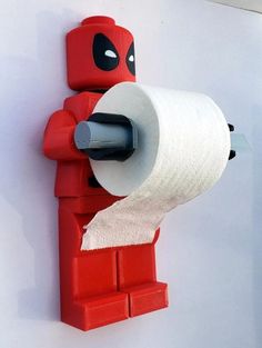 there is a deadpool toilet paper holder on the wall