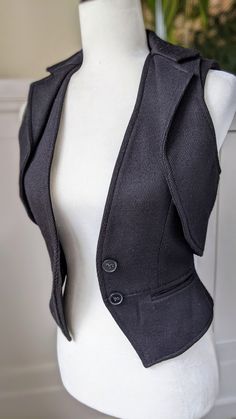 Vintage avantgarde style couture Alexander Wang wool vest in size 0. Fully lined in excellent vintage condition. Wool blend with double shoulders. Two buttons, two faux pockets, felt lined collar with a back pleat. Super stylish! Fits XS / XXS Measurements laying flat in inches:  shoulder to shoulder 13 armpit to armpit 14 waist 12.5 shoulder to hem 18 Stylish Fits, Jacket Ideas, Hoodie Vest, Wool Vest, Avant Garde Fashion, Silk Slip Dress, Black Vest, Silk Slip, Sewing Clothes